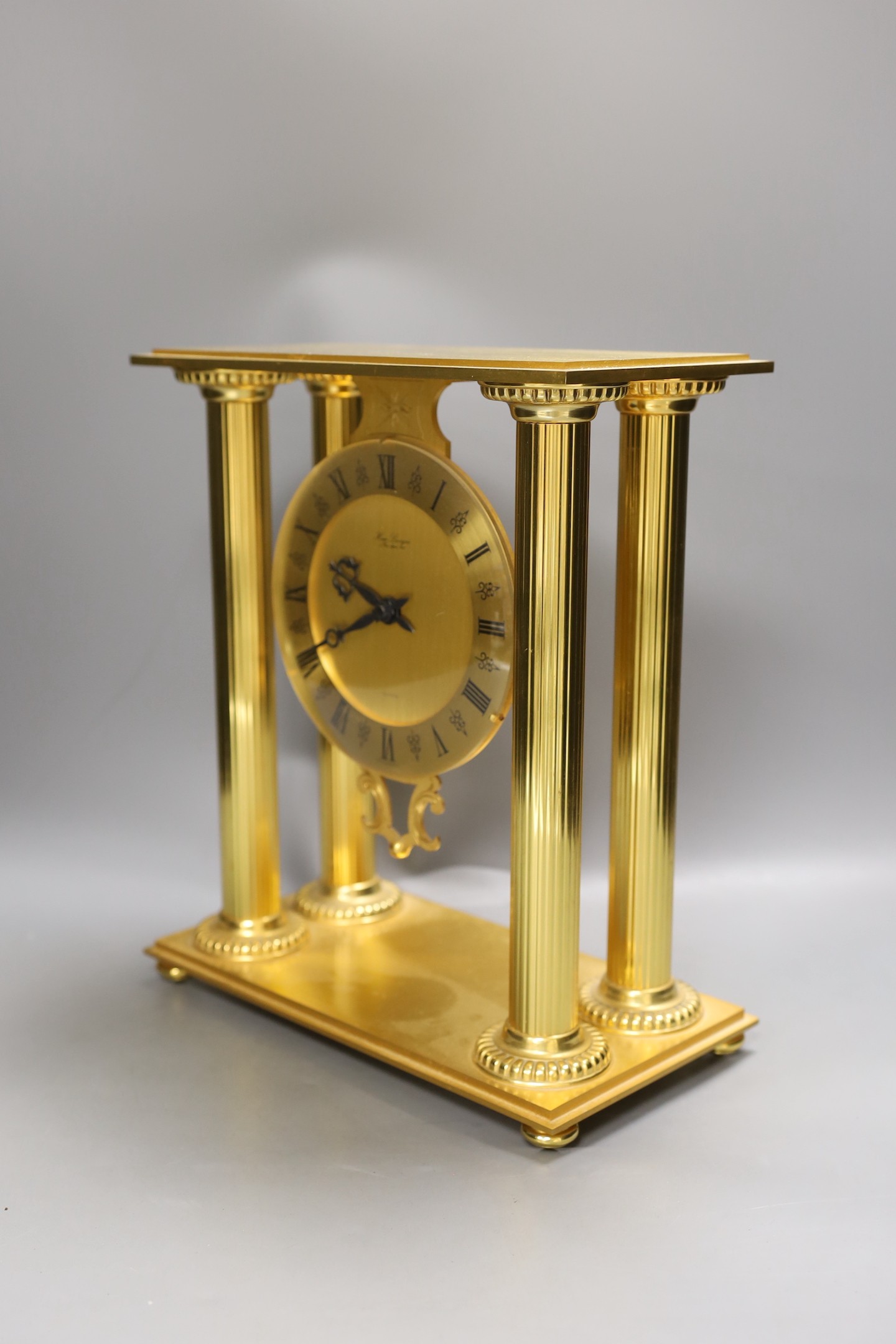 A contemporary Hour Lavigne gilt metal cased quartz mantel clock